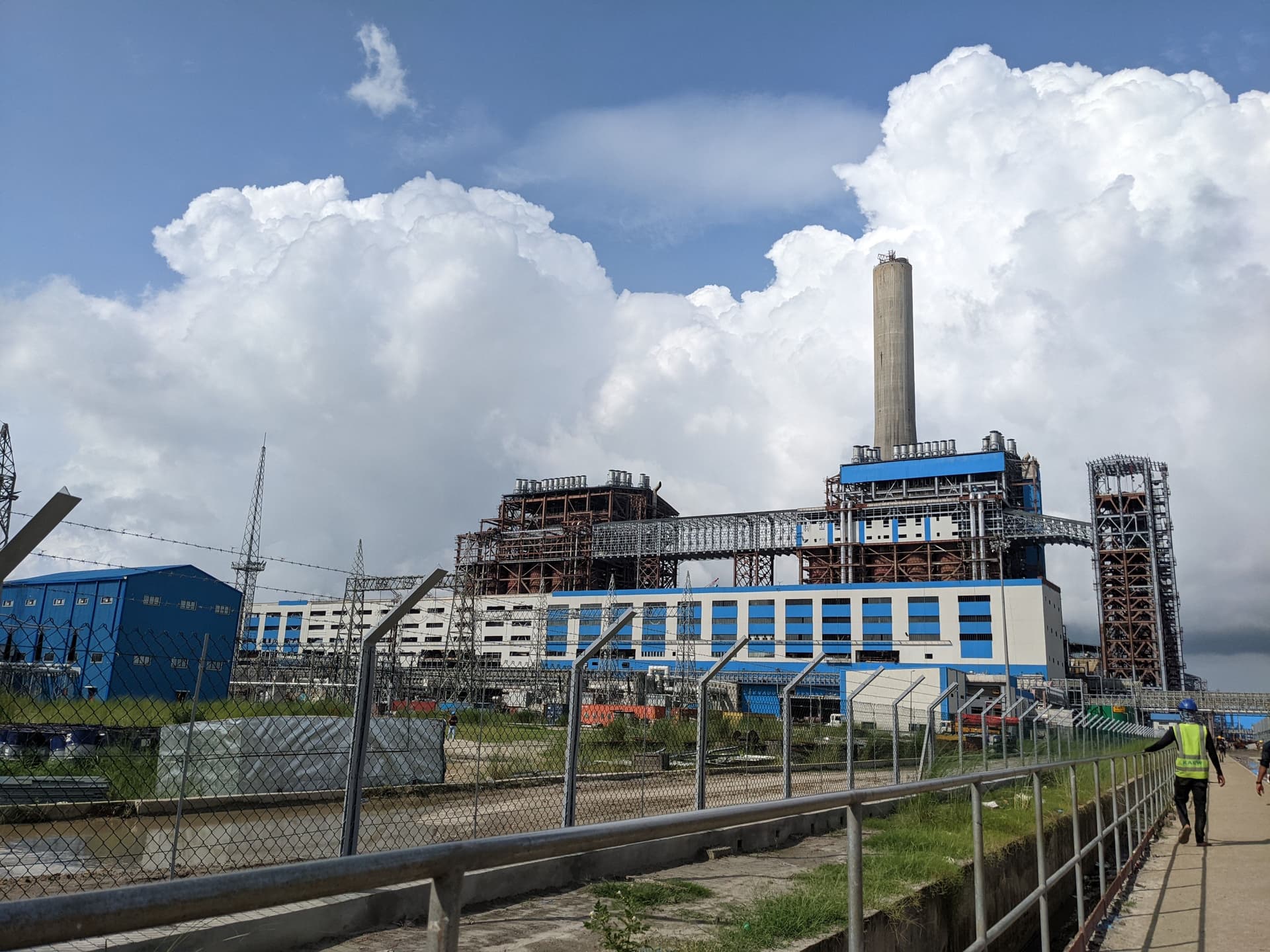 Industrial energy site perimeter with people and infrastructure